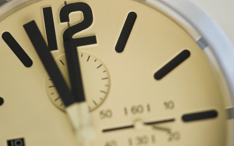 "Clock. Just before deadline - time, stress or rush business concept"